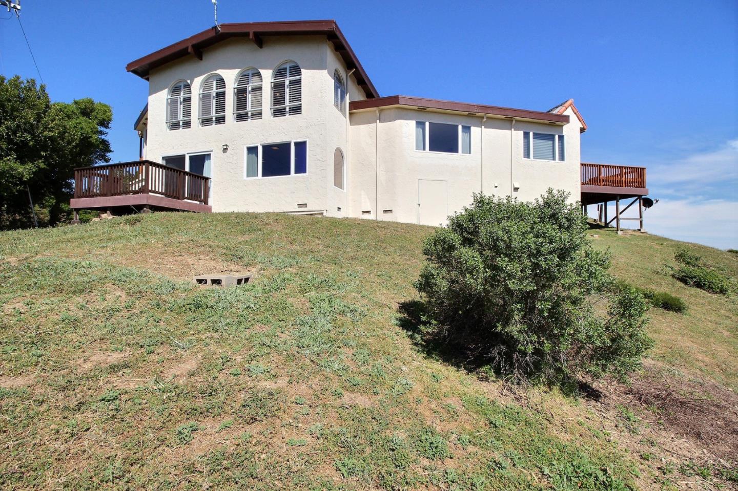 16999 McGill Road Saratoga, CA 95070 - Photo 36 of 41 a front view of a house with a yard