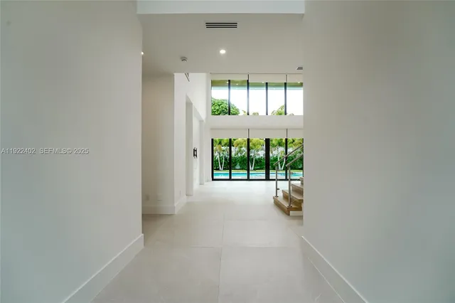 a view of entryway and hall with dining room