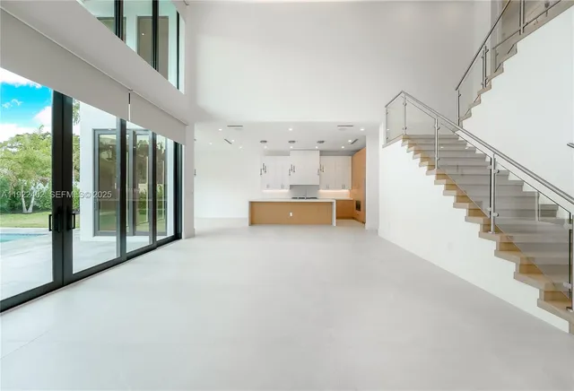 a white toilet sitting next to a white wall