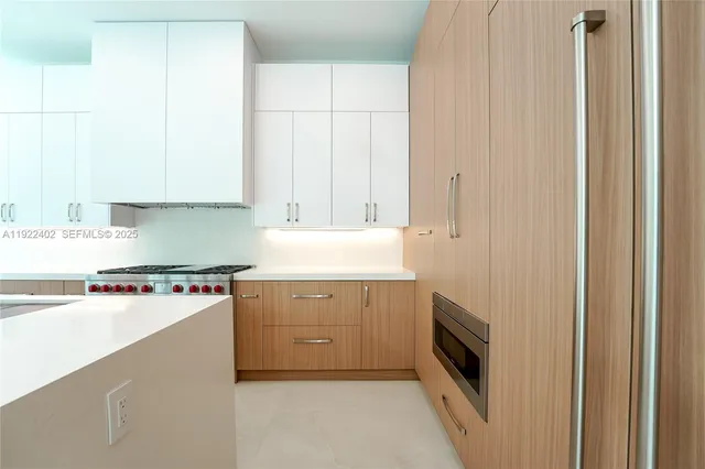 a bathroom with a granite countertop sink a toilet and shower