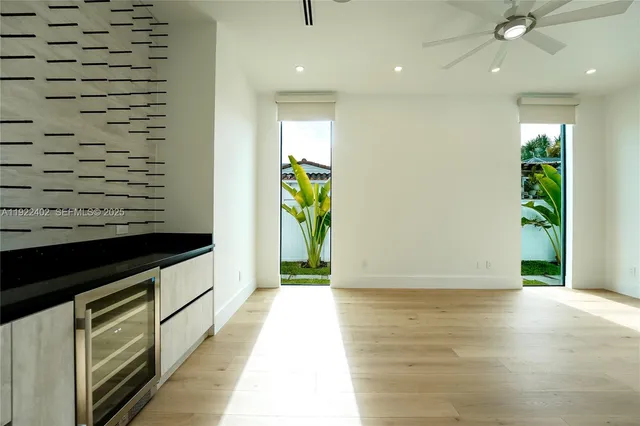 a view of a room with shelves on the wall