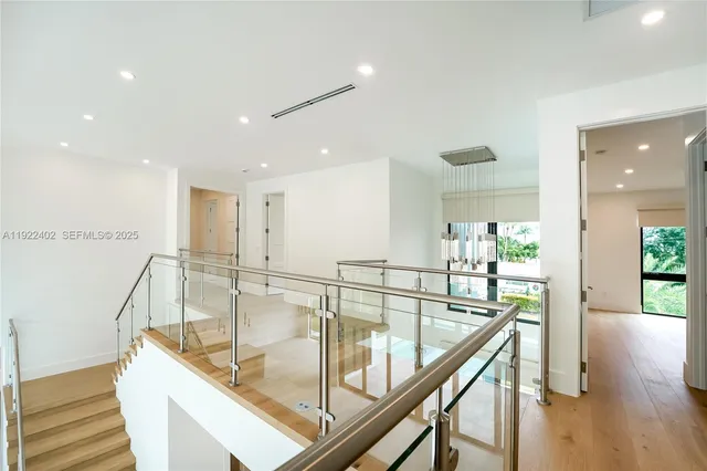 a utility room with cabinets washer and dryer