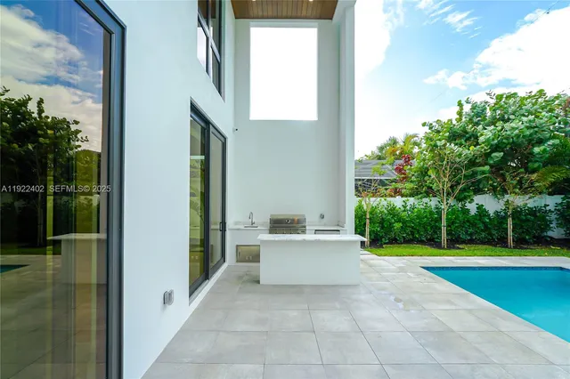 a kitchen with a stove top oven sink and cabinets