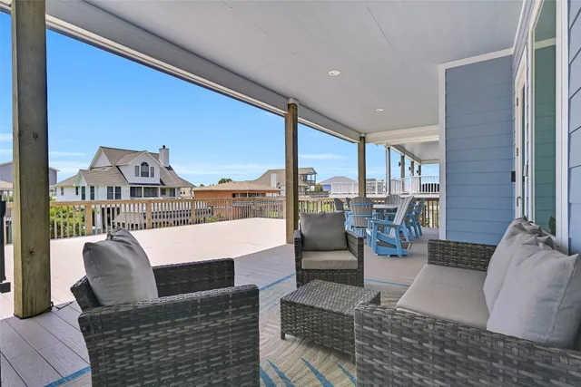 a view of a patio with table and chairs