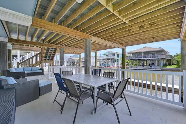 a view of a lake with a table and chairs