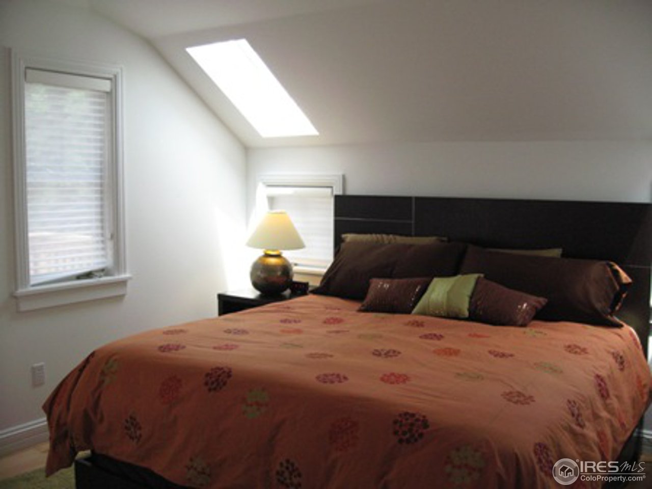 1023 Forest Avenue Boulder, CO 80304 - Photo 5 of 13 a bedroom with a bed and window