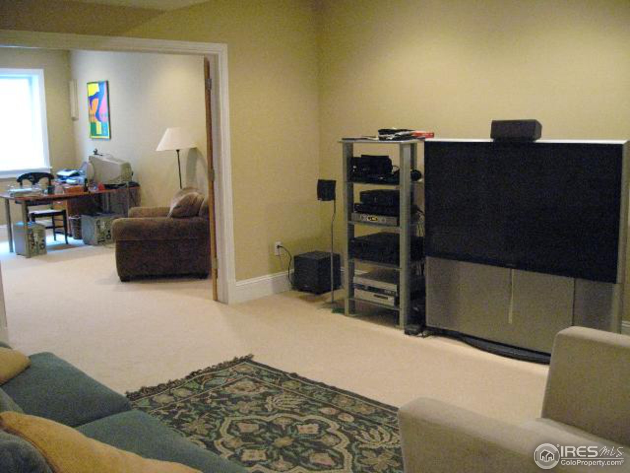 1023 Forest Avenue Boulder, CO 80304 - Photo 7 of 13 a living room with furniture and a flat screen tv