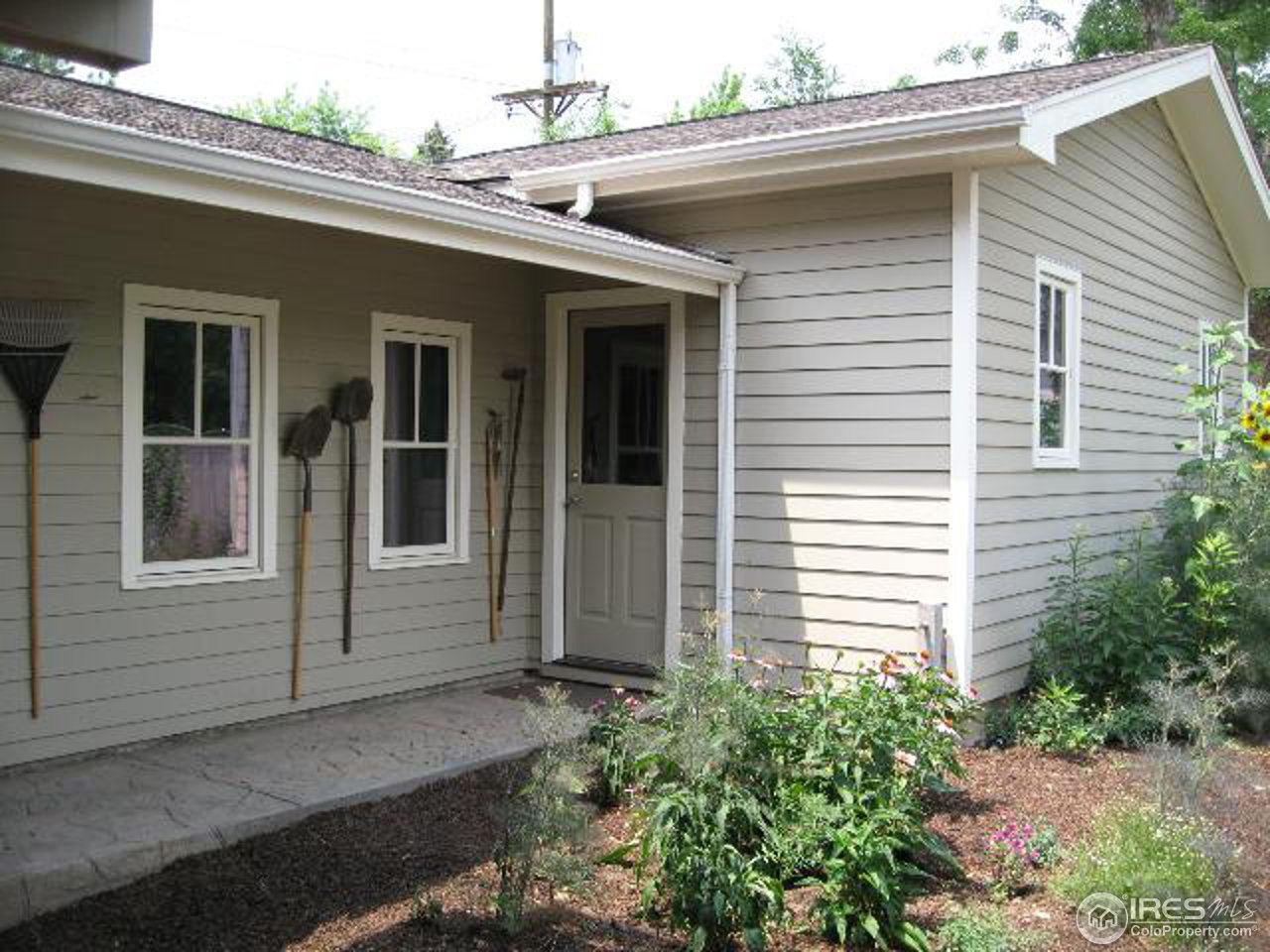 1023 Forest Avenue Boulder, CO 80304 - Photo 10 of 13 a view of a white house next to a yard