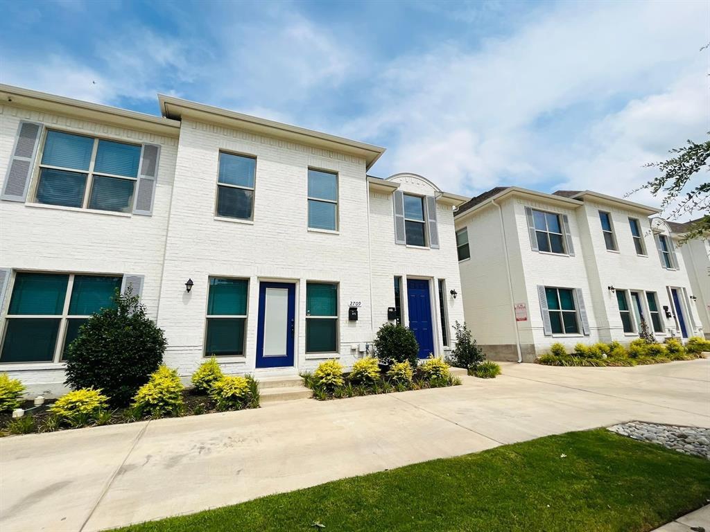 2707 McCart Avenue, Unit 209 Fort Worth, TX 76110 - Photo 1 of 25 a front view of a house with a yard
