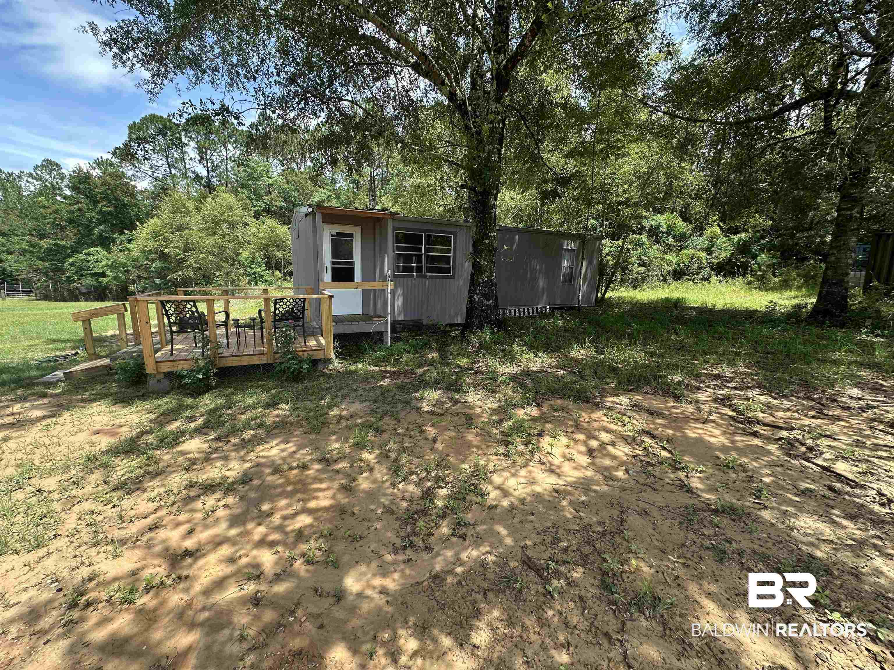 21305 River Road Robertsdale, AL 36567 - Photo 22 of 50 View of yard featuring a storage shed