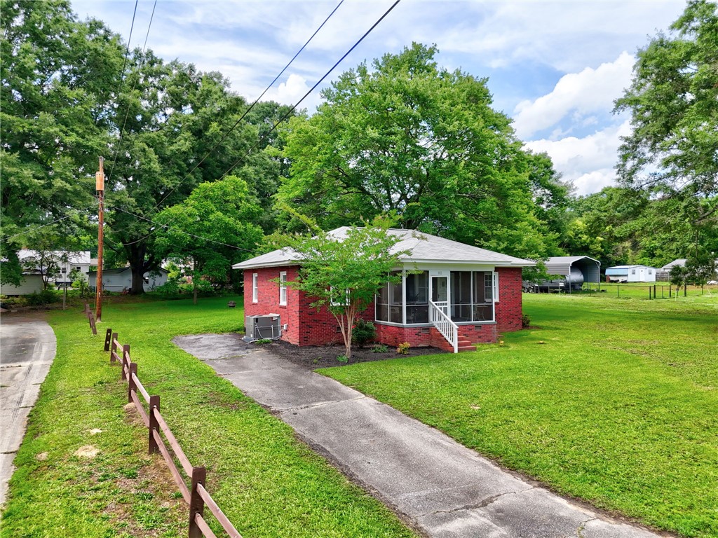 102 Graham Honea Path, SC 29654 - Photo 23 of 29 A charming red brick residence with a screened porch awaits in a green, tranquil setting.