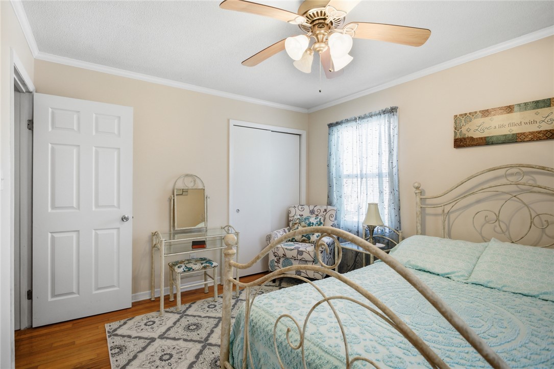 108 Hodge Street Abbeville, SC 29620 - Photo 16 of 39 Hardwood flooring adds warmth to this tranquil bedroom, offering a peaceful retreat.