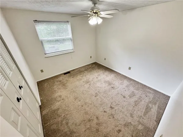 en empty room with fan