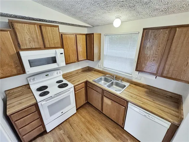 a kitchen with a stove and a microwave