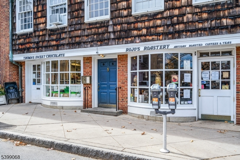 front view of a brick building with a large window