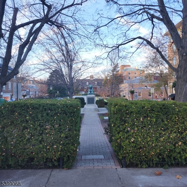 31 Palmer Square West, Unit B Princeton, NJ 08542 - Photo 13 of 13 a view of a pathway both side of house with a yard