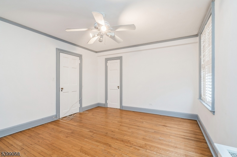 31 Palmer Square West, Unit B Princeton, NJ 08542 - Photo 4 of 13 wooden floor in an empty room with a window