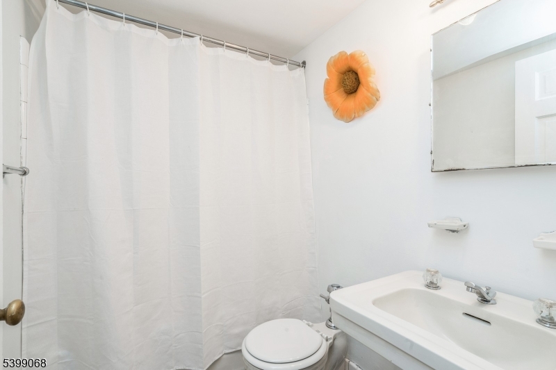 31 Palmer Square West, Unit B Princeton, NJ 08542 - Photo 5 of 13 a bathroom with a sink and mirror
