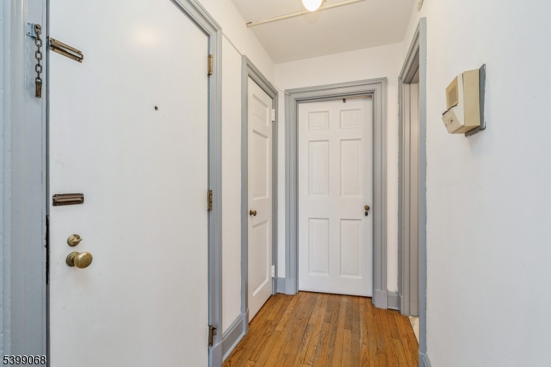 31 Palmer Square West, Unit B Princeton, NJ 08542 - Photo 6 of 13 a view of a hallway with wooden floor and closet