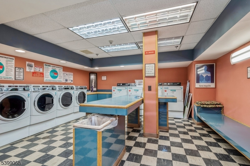 31 Palmer Square West, Unit B Princeton, NJ 08542 - Photo 8 of 13 a utility room with stainless steel appliances and cabinets