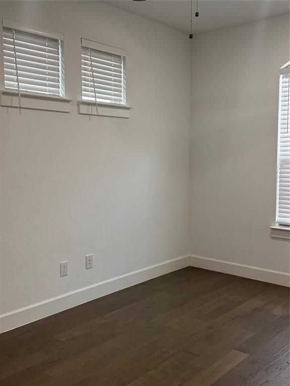 2152 Hermann Lane Carrollton, TX 75010 - Photo 17 of 18 an empty room with wooden floor and windows