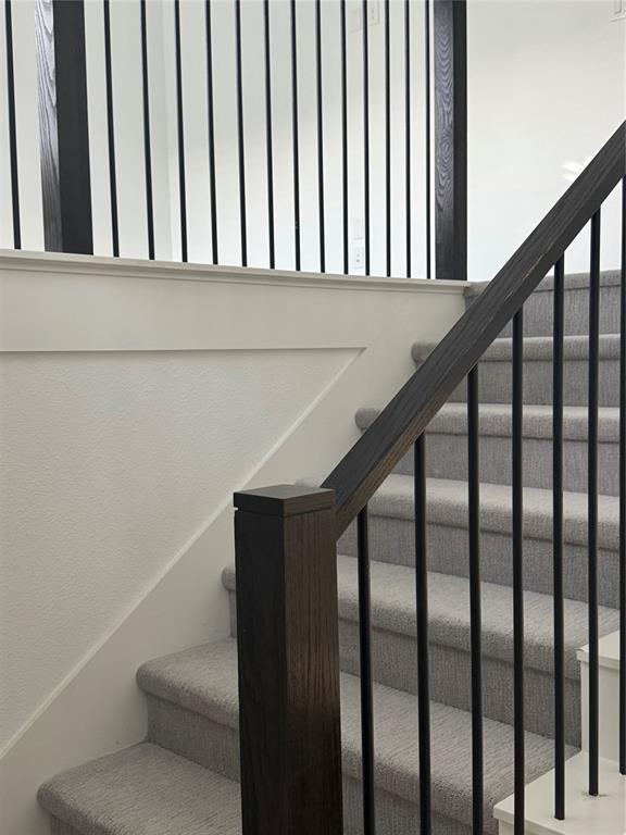 2152 Hermann Lane Carrollton, TX 75010 - Photo 4 of 18 a view of staircase with railing and white walls