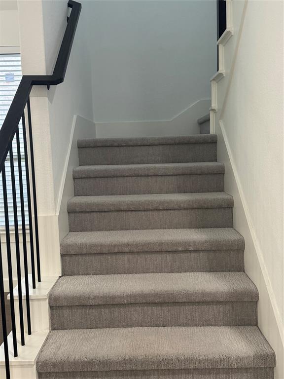 2152 Hermann Lane Carrollton, TX 75010 - Photo 9 of 18 a view of staircase with white walls