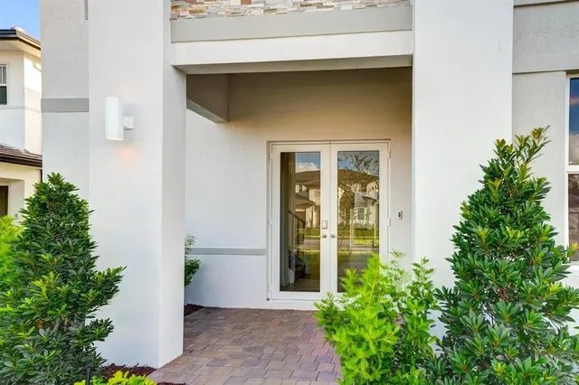 a view of empty room with wooden floor and stairs