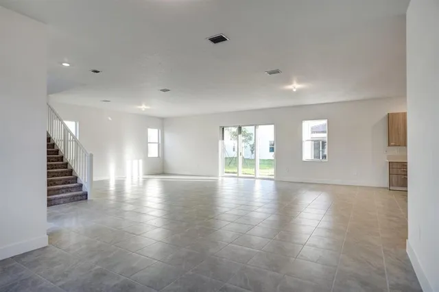 a view of kitchen with furniture and wooden floor