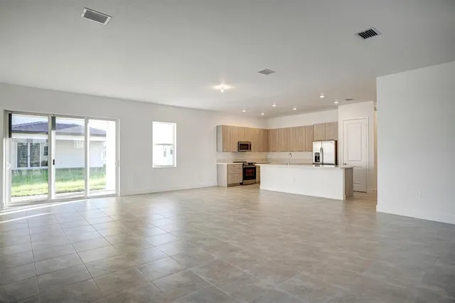 a view of an empty room with a window