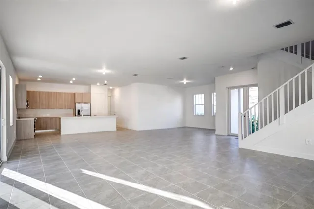 a kitchen with a microwave and cabinets