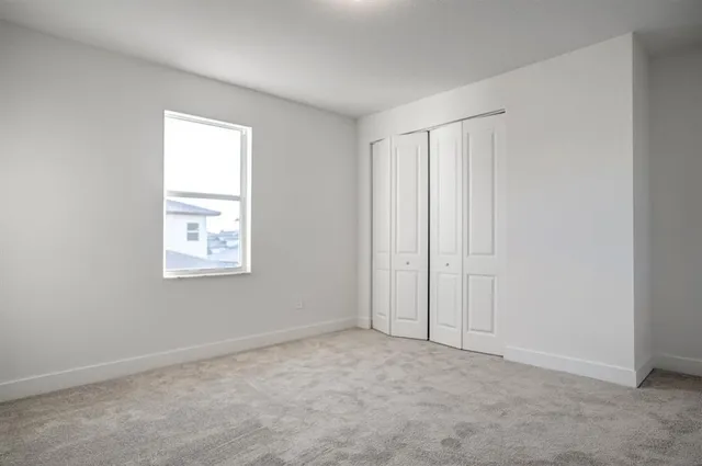 an aerial view of residential houses with yard