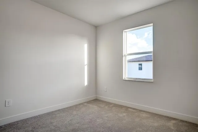 an aerial view of a house with a swimming pool yard and lake view