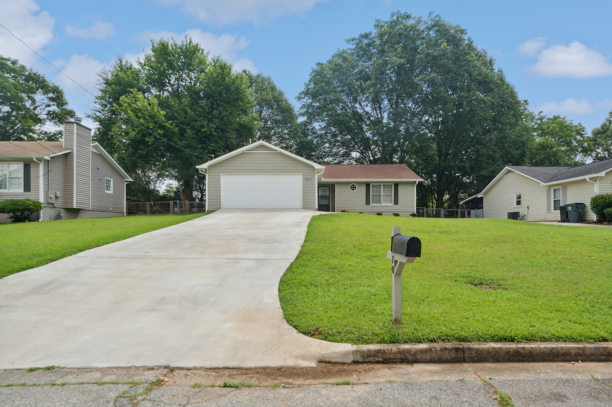 6070 Chaseland Road Rex, GA 30273 - Photo 1 of 1 a front view of house with yard and green space