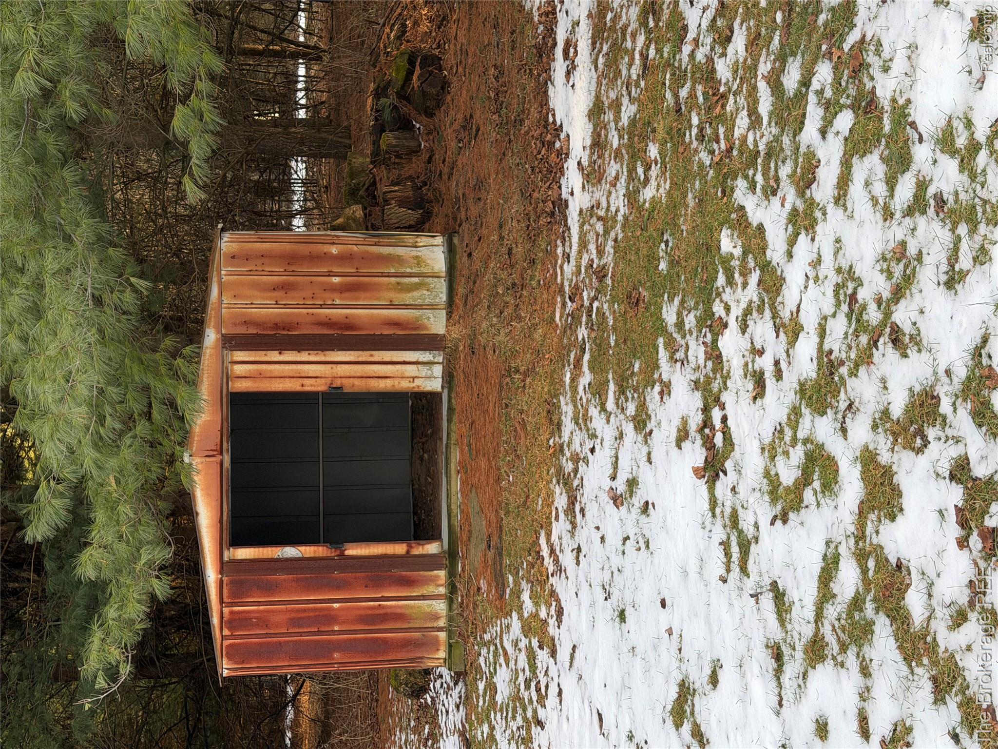 13405 Fagan Road Holly, MI 48442 - Photo 55 of 57 Snow covered structure with a storage shed