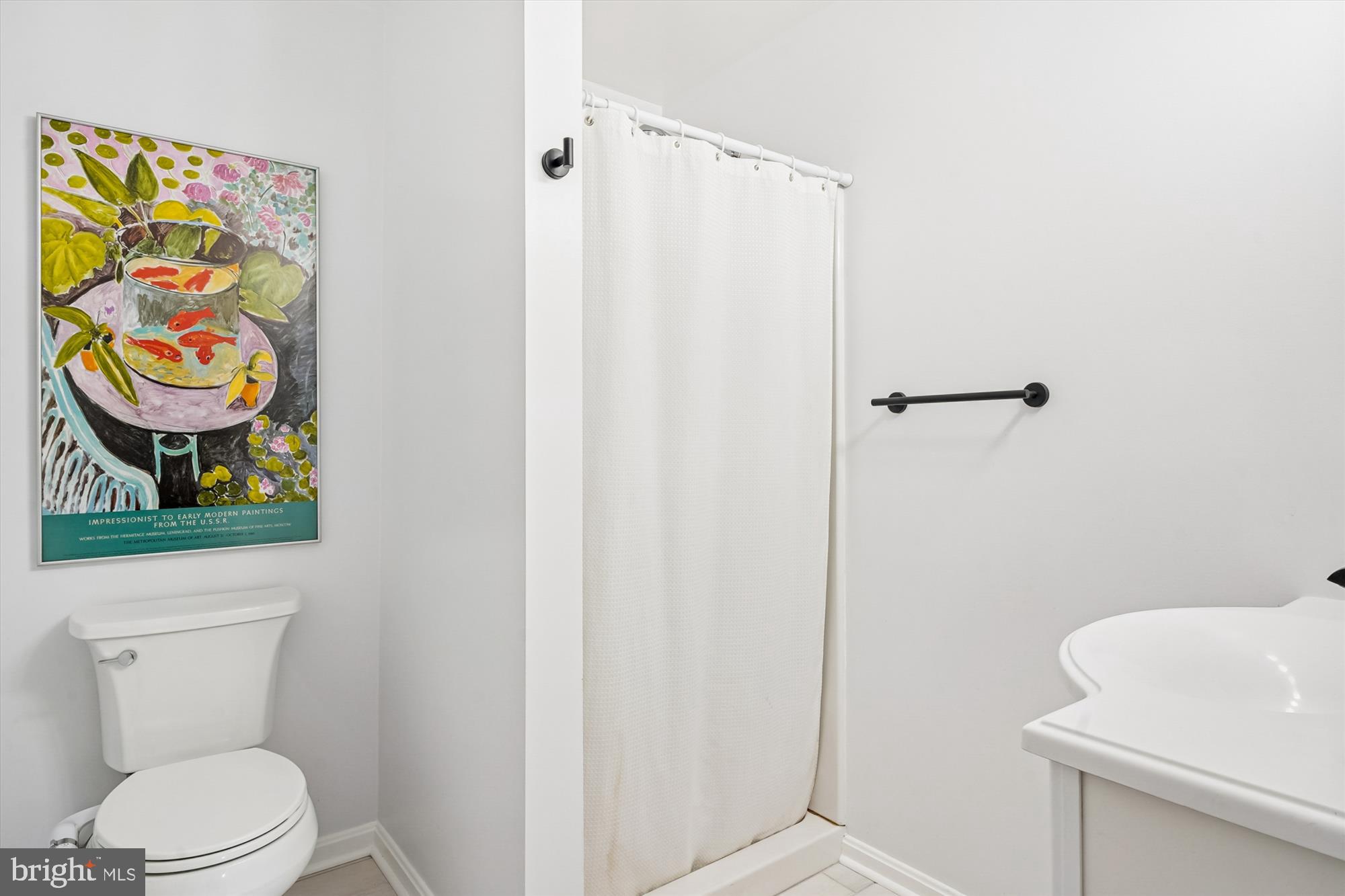 3064 Centre Road Riva, MD 21140 - Photo 20 of 45 a bathroom with a toilet and a shower curtain