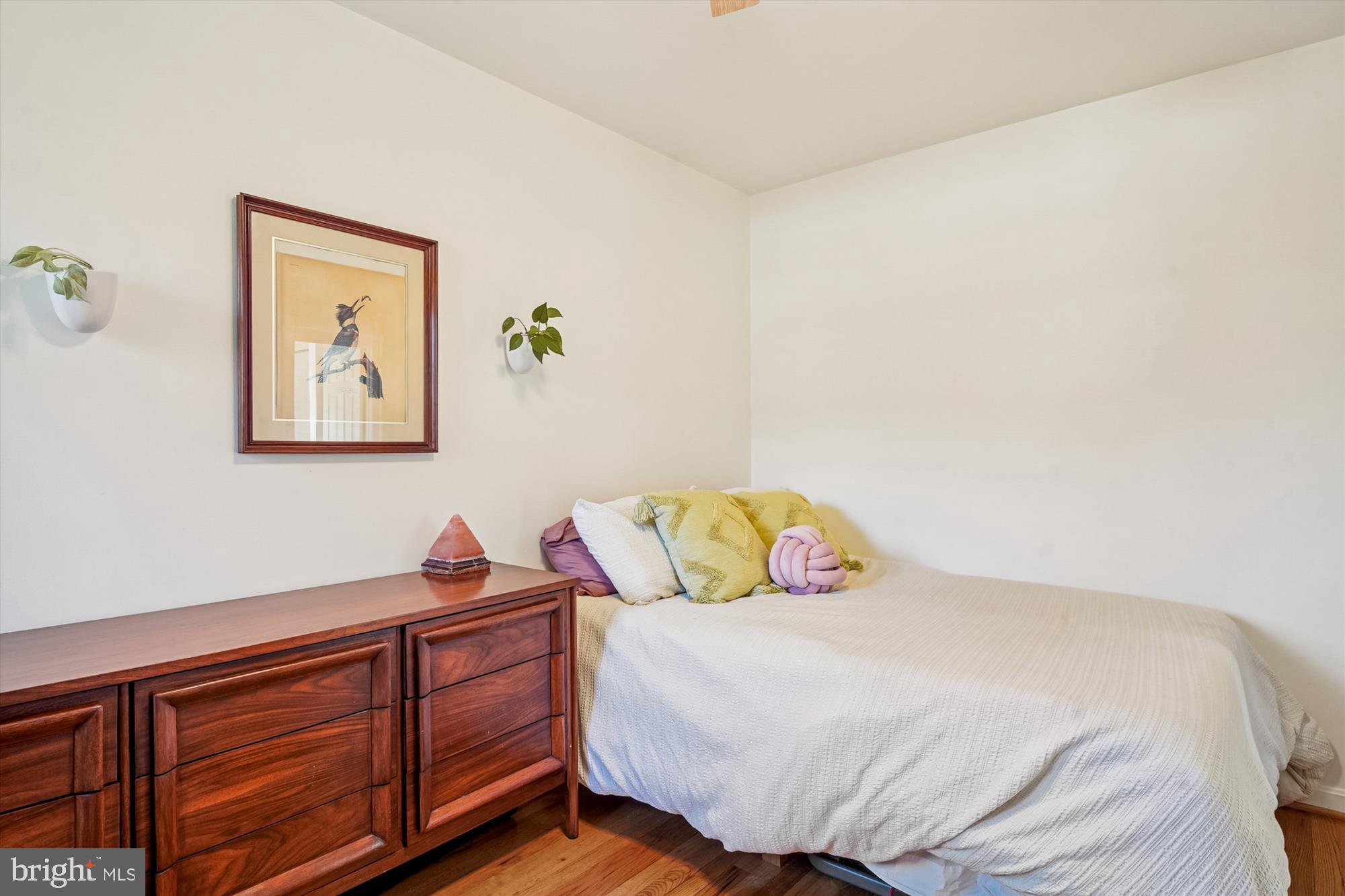 3064 Centre Road Riva, MD 21140 - Photo 23 of 45 a bedroom with a bed and a lamp on dresser