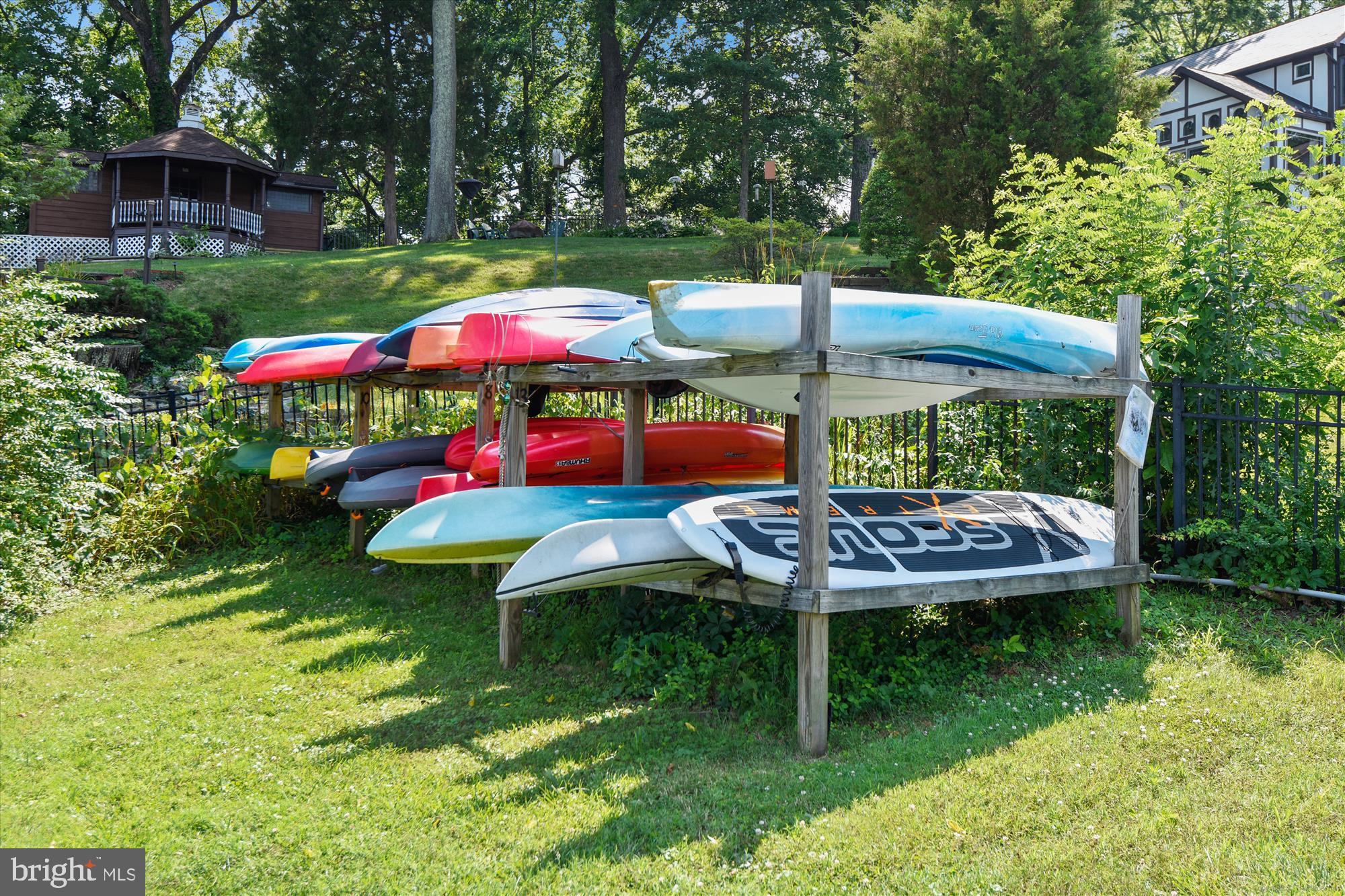 3064 Centre Road Riva, MD 21140 - Photo 43 of 45 a view of a table and chairs under an umbrella in backyard