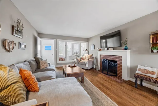 a view of a livingroom with furniture and a fireplace