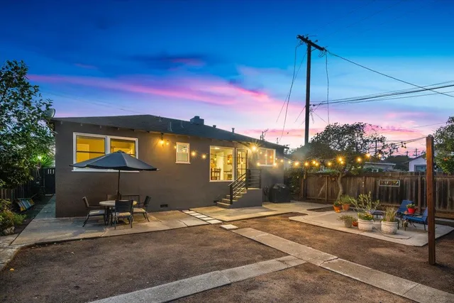 a swimming pool with outdoor seating and yard