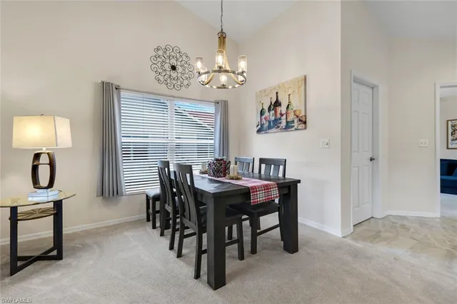 a large bed sitting in a bedroom next to a window