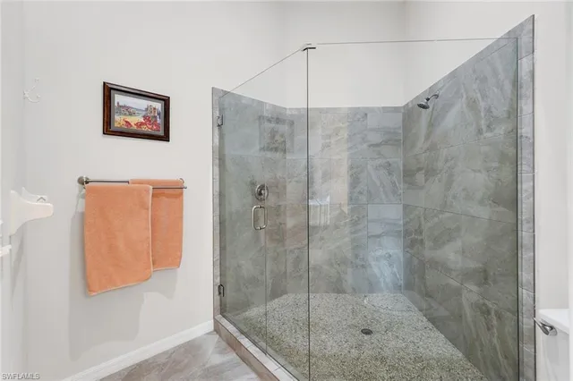 a bedroom with a bed dresser and a window