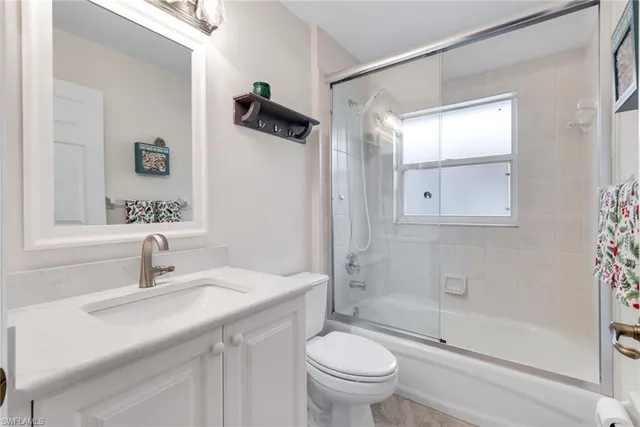 a view of a livingroom with workspace and a couch