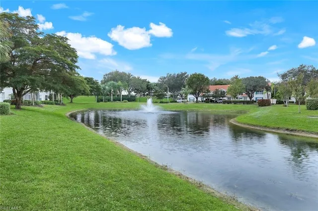 a view of a lake with a house in the background