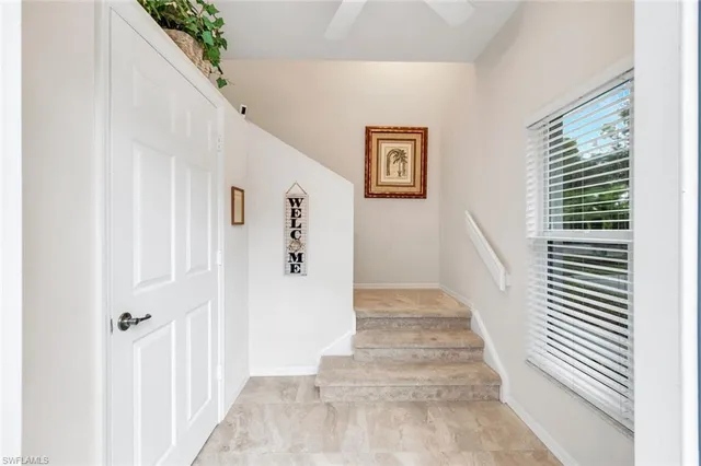 a room with kitchen island a sink and a stove with wooden floor