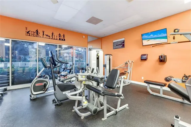 a view of swimming pool with outdoor seating and plants