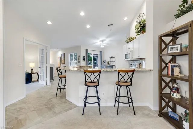 a view of living room with granite countertop furniture and fireplace