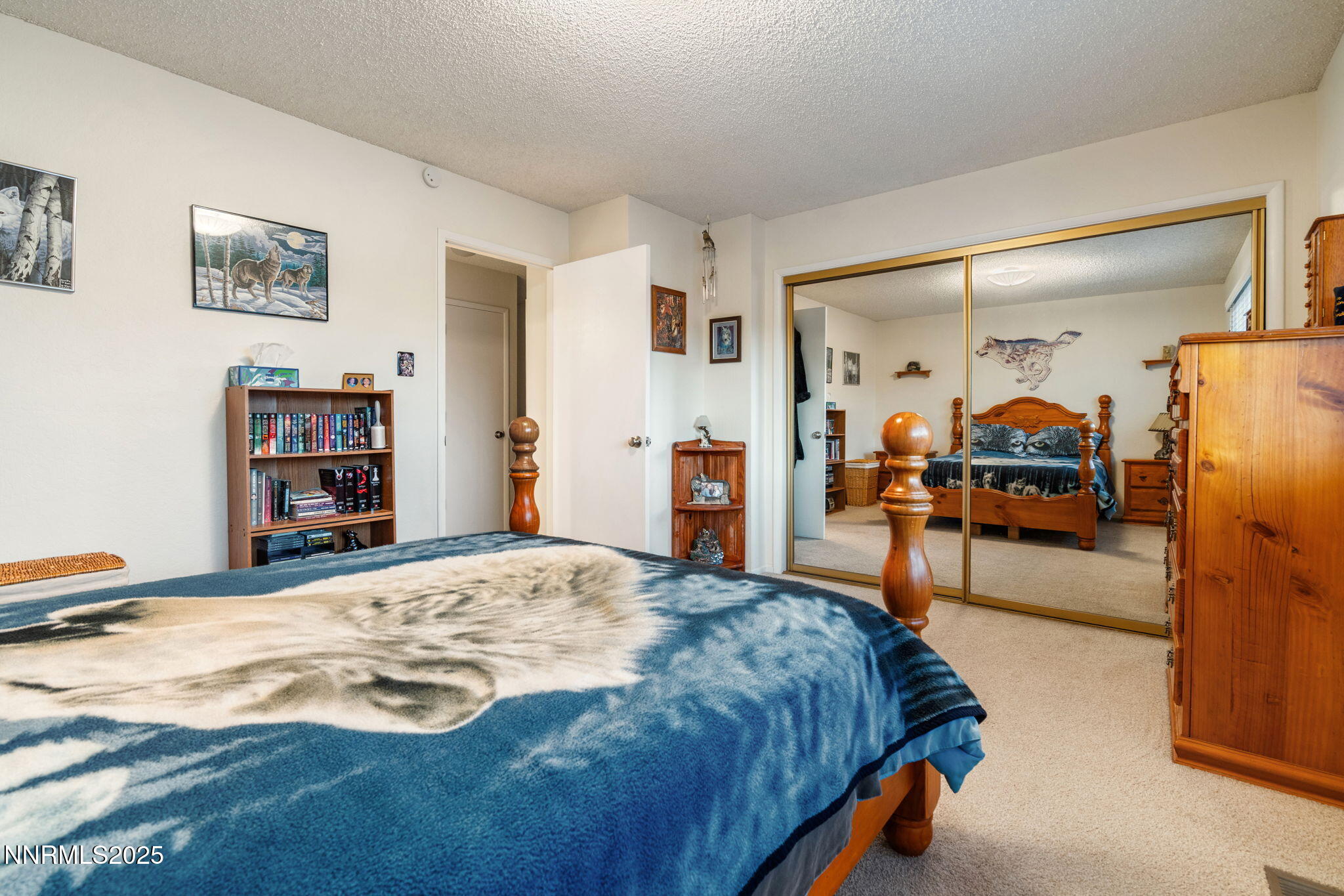 2282 Cannonball Road Sparks, NV 89431 - Photo 14 of 21 a bedroom with a bed and a large mirror