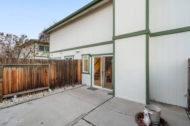 a view of a building with wooden fence