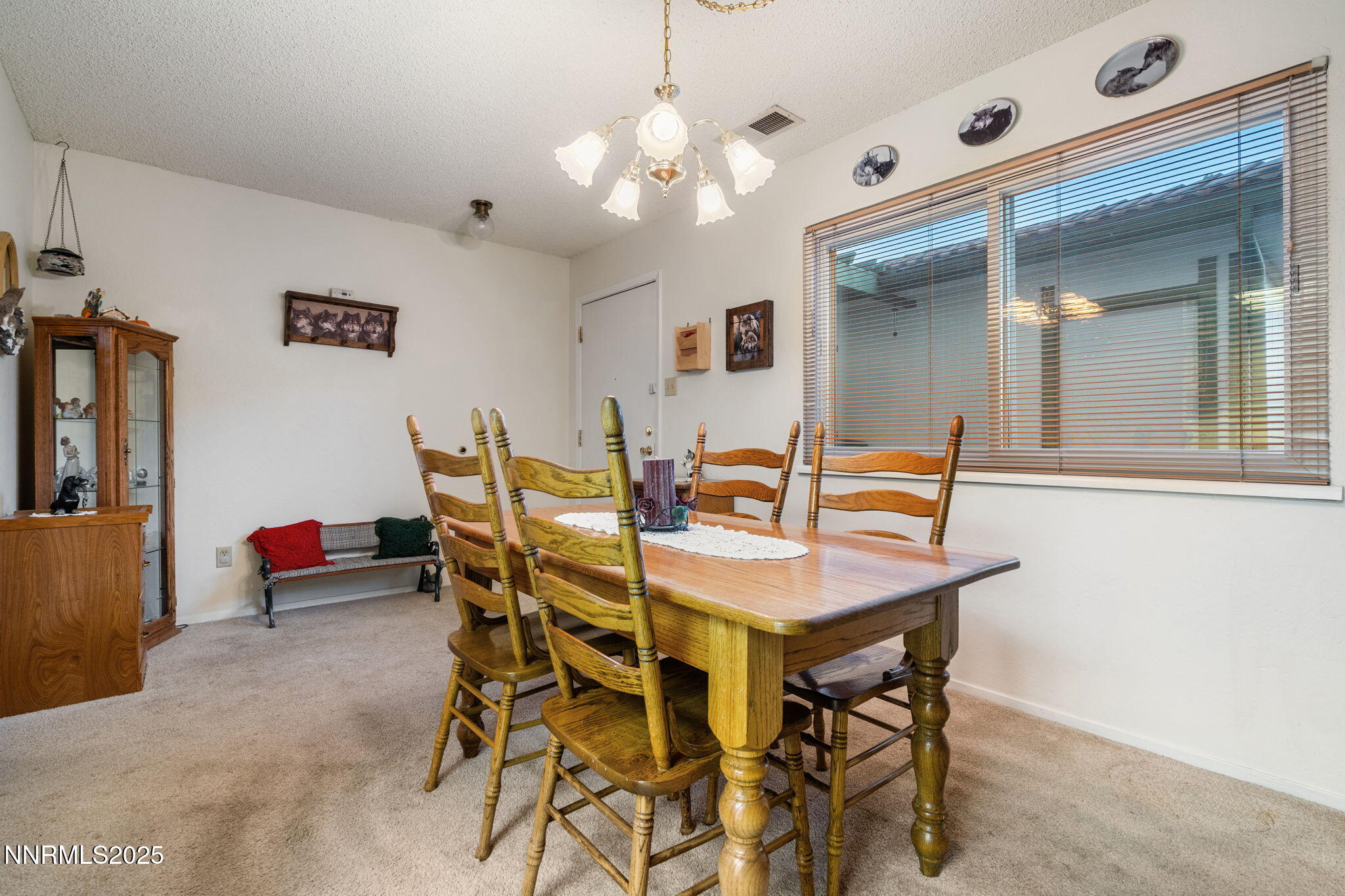 2282 Cannonball Road Sparks, NV 89431 - Photo 3 of 21 a view of a dining room with furniture and chandelier